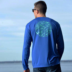 young man in royal blue performance fishing shirt by Hook Life on the water 