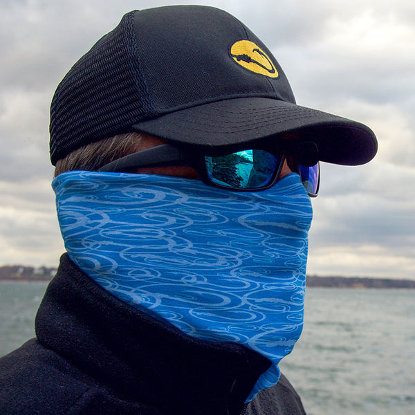 man wearing blue neck gaiter by Hook Life on the water