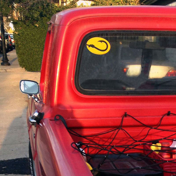 Hook Life fishing bumper sticker on a vintage red pickup truck 