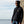 Load image into Gallery viewer, young man in black Hookie fishing hoodie sweatshirt on sea wall
