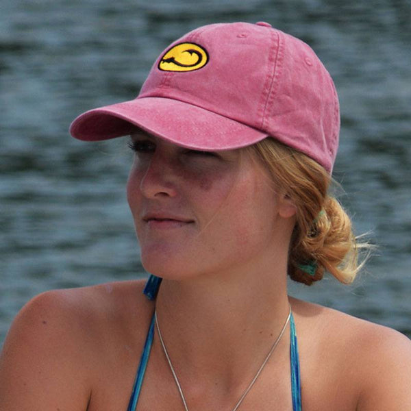 young woman wearing red Beach fishing cap by Hook Life on the water